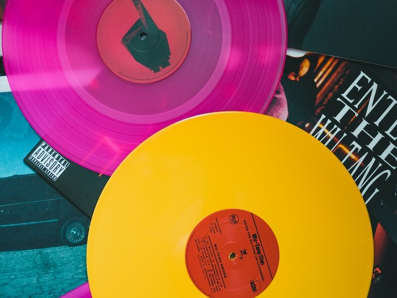 purple vinyl record on black and white table