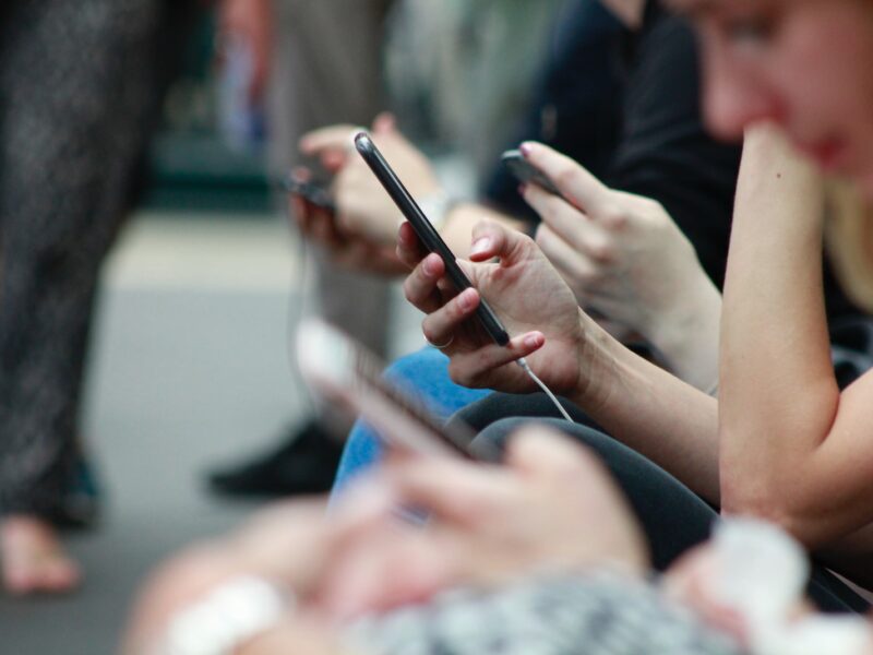 person holding black phone