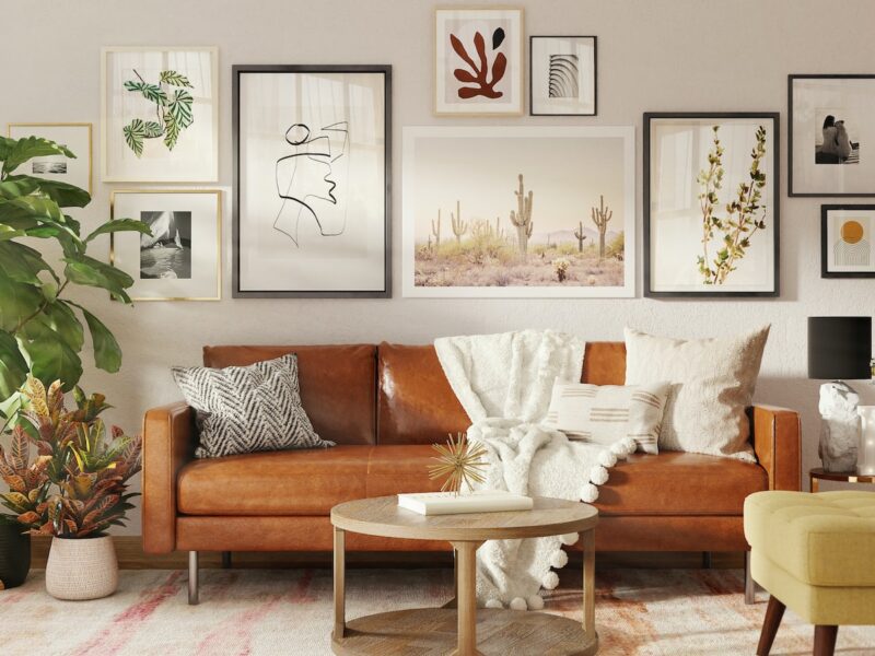 brown wooden framed white padded armchair