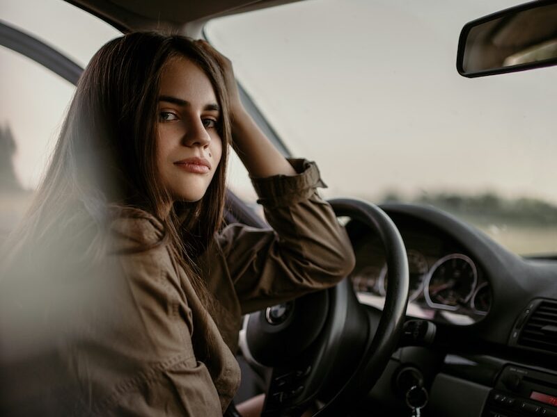 woman sitting inside car